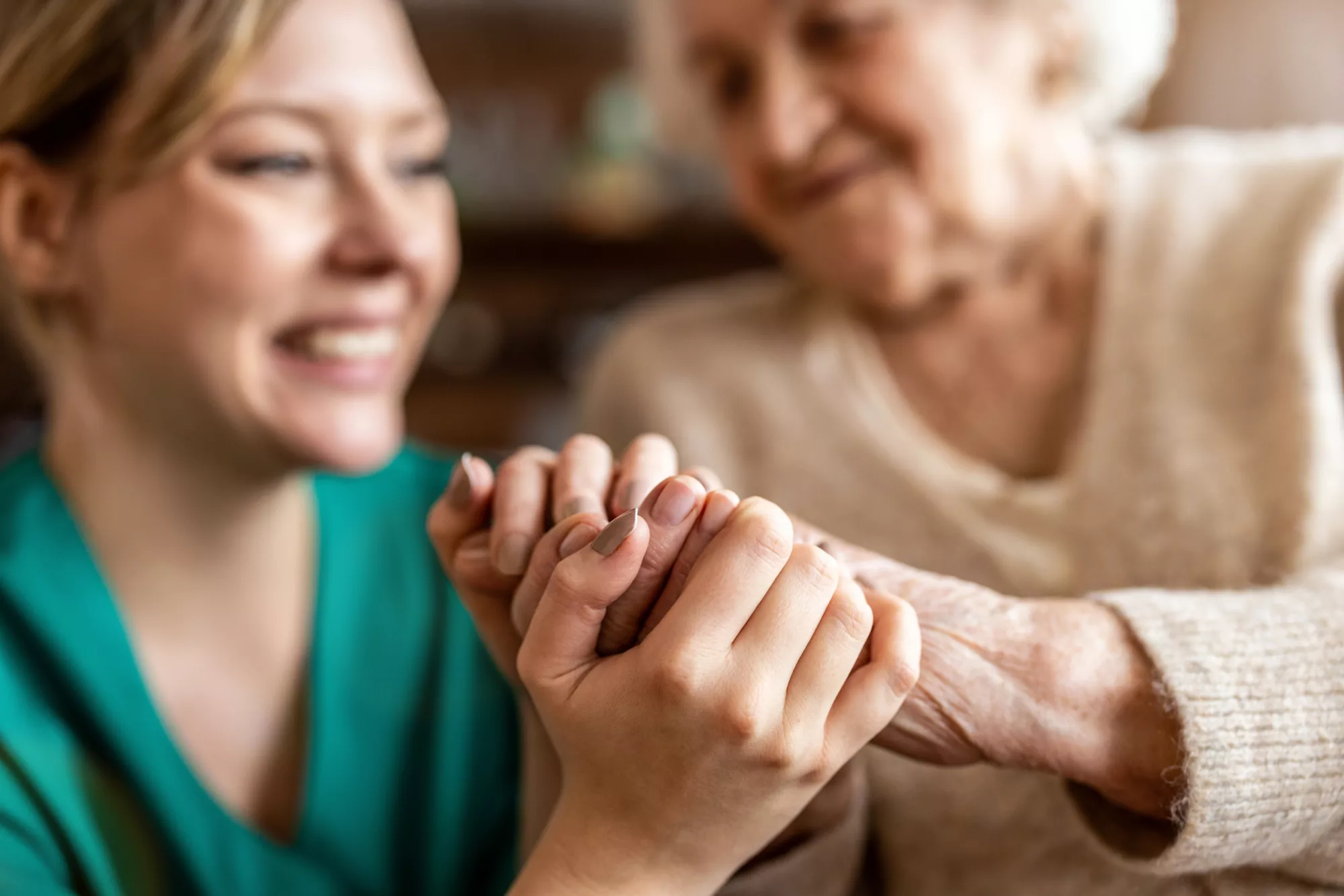 Healthcare professional helping elderly patient